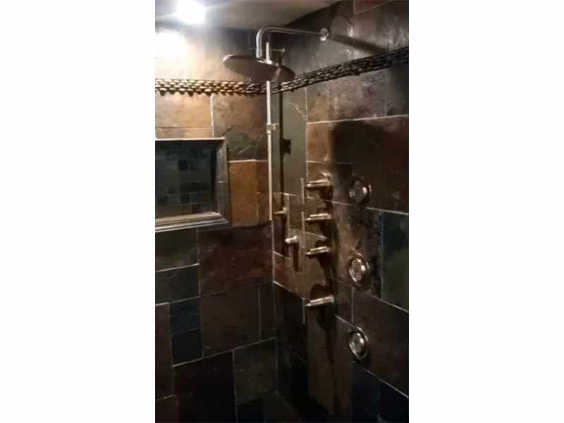 Body Jets with Rainhead in a Slate Bathroom Remodel in Aurora, IL - JW Construction & Design Studio Services